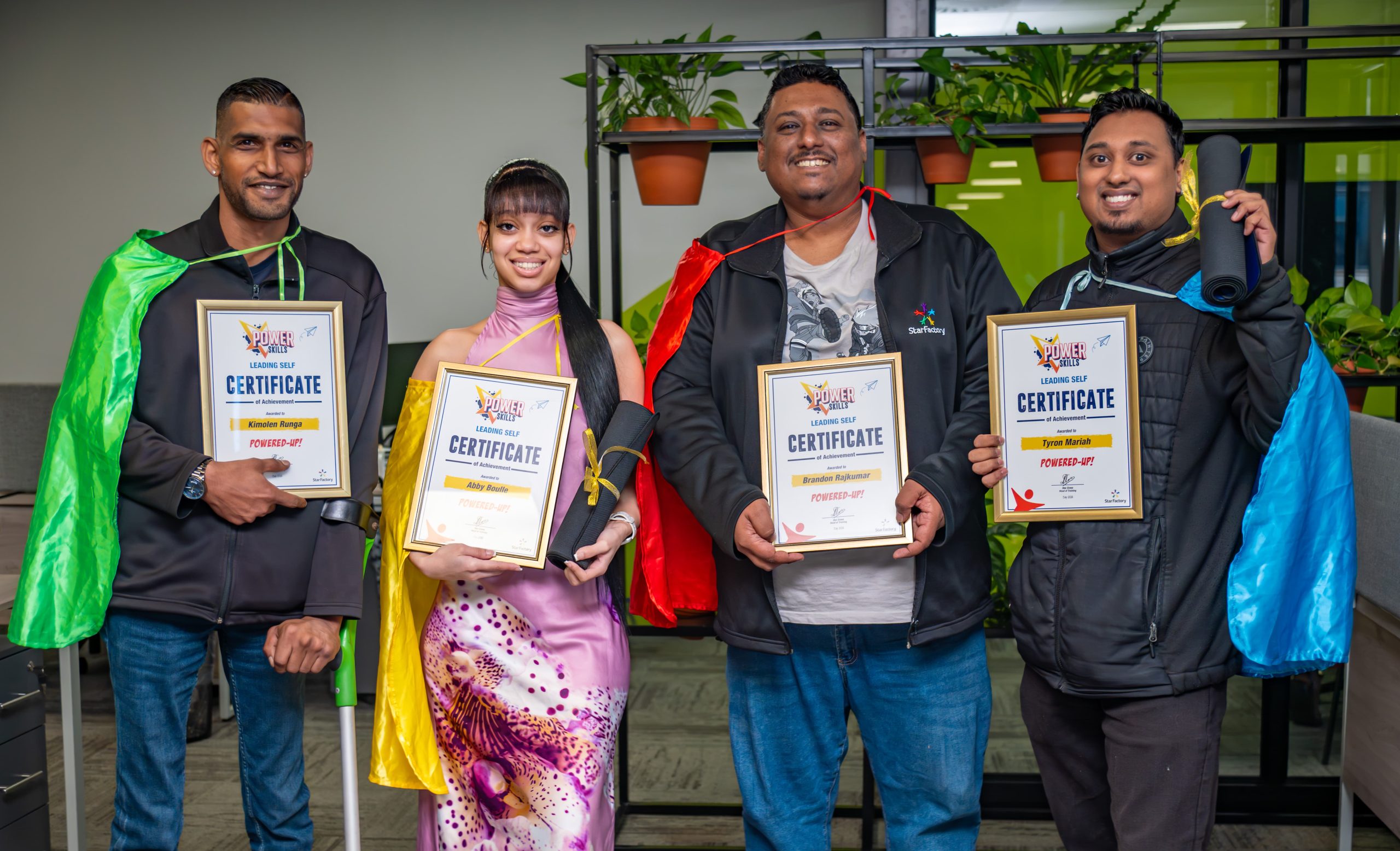 Four Star Factory learners celebrating with their certificates